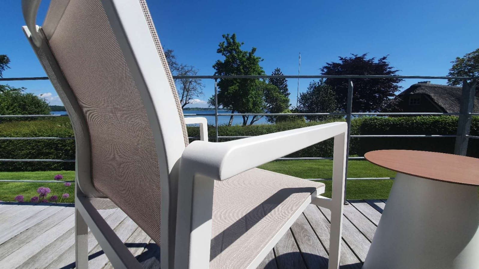 Custom outdoor cruise balcony chair and side table detail by Njords Ark